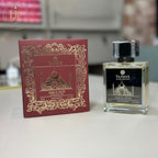 Taj Max Aqua Oud perfume bottle and packaging on a white background
