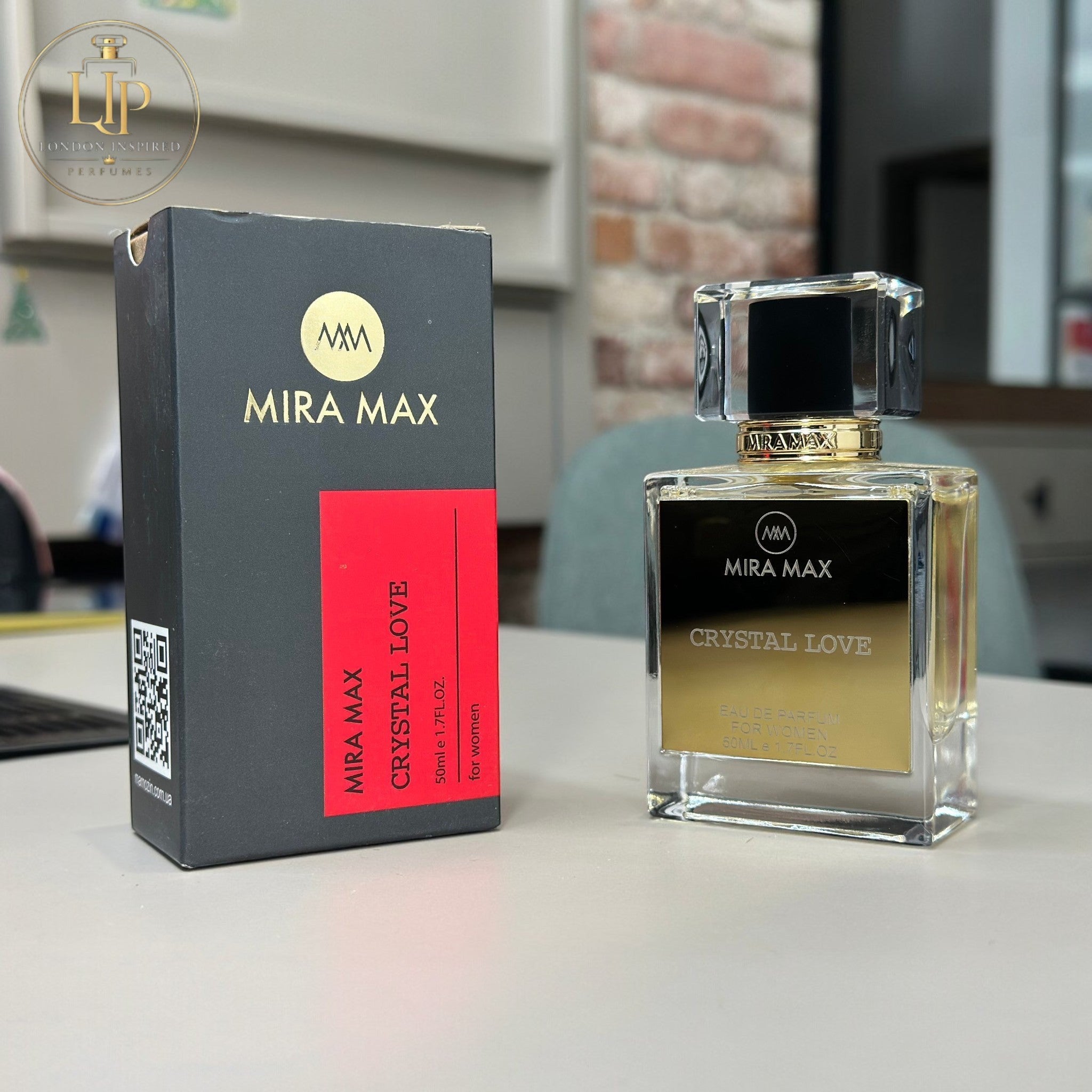 Mira Max Crystal Love perfume bottle and packaging on a table.