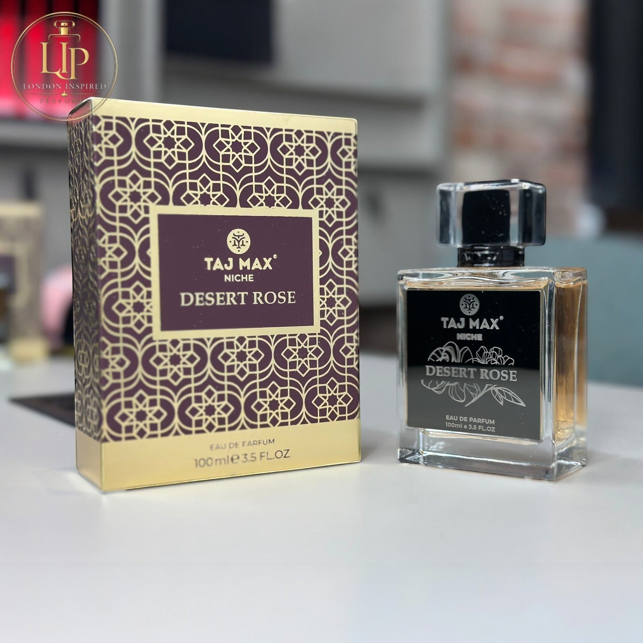 Taj Max Desert Rose perfume bottle and packaging on a table