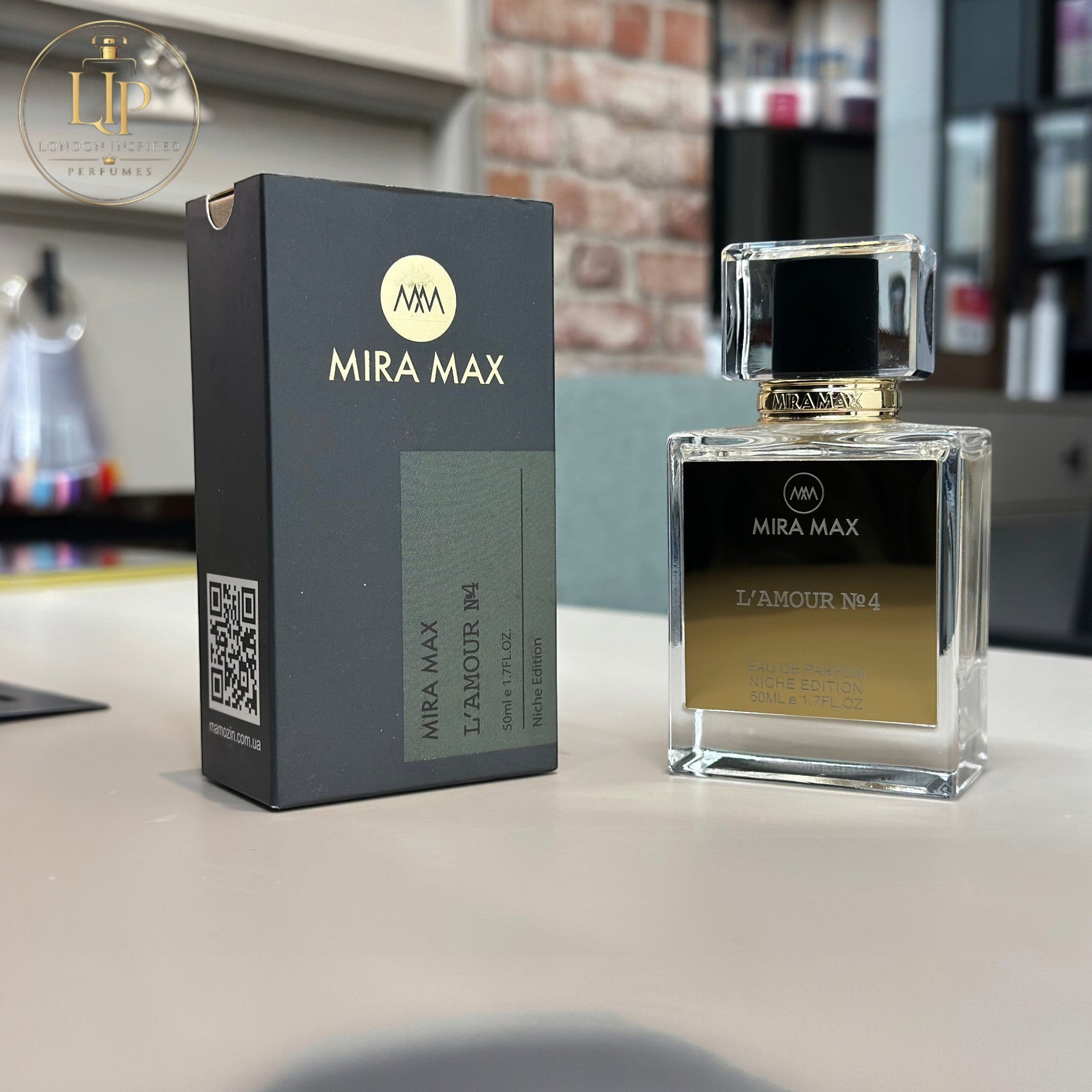 MIRA MAX perfume bottle and packaging on a surface with a blurred background