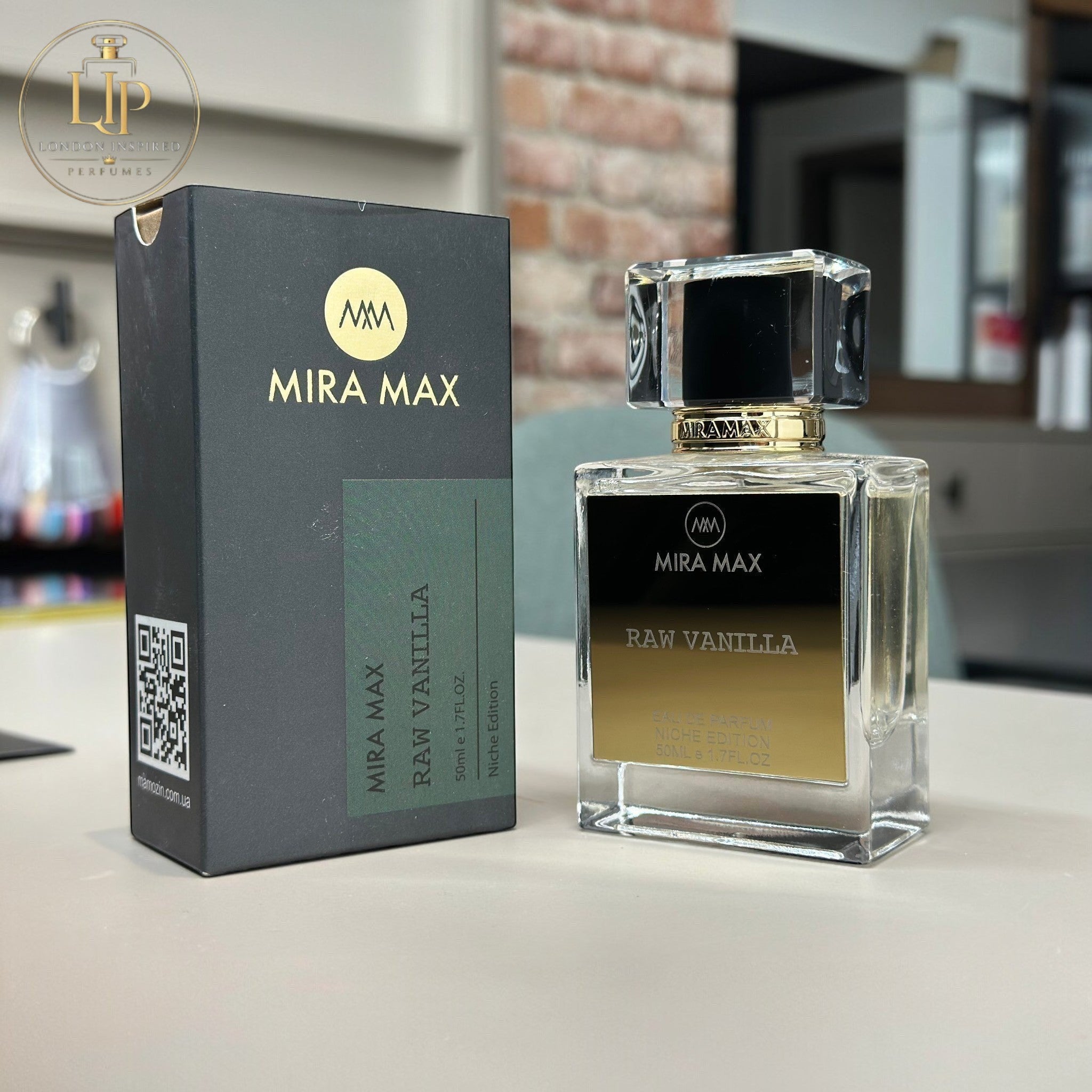 MIRA MAX Raw Vanilla perfume bottle and packaging on a surface with a blurred background