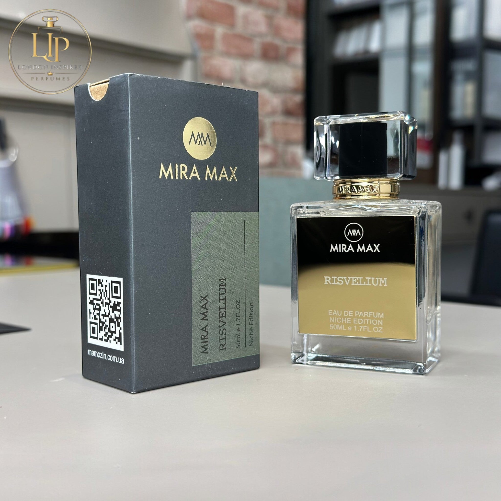 MIRA MAX perfume bottle and packaging on a surface with a blurred background