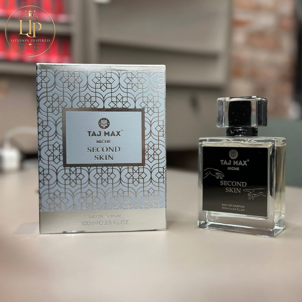 Taj Max perfume bottle and packaging on a table