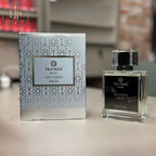 Taj Max perfume bottle and packaging on a table