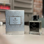 Perfume bottle and packaging of TAJ MAX Niche Second Skin on a blurred background