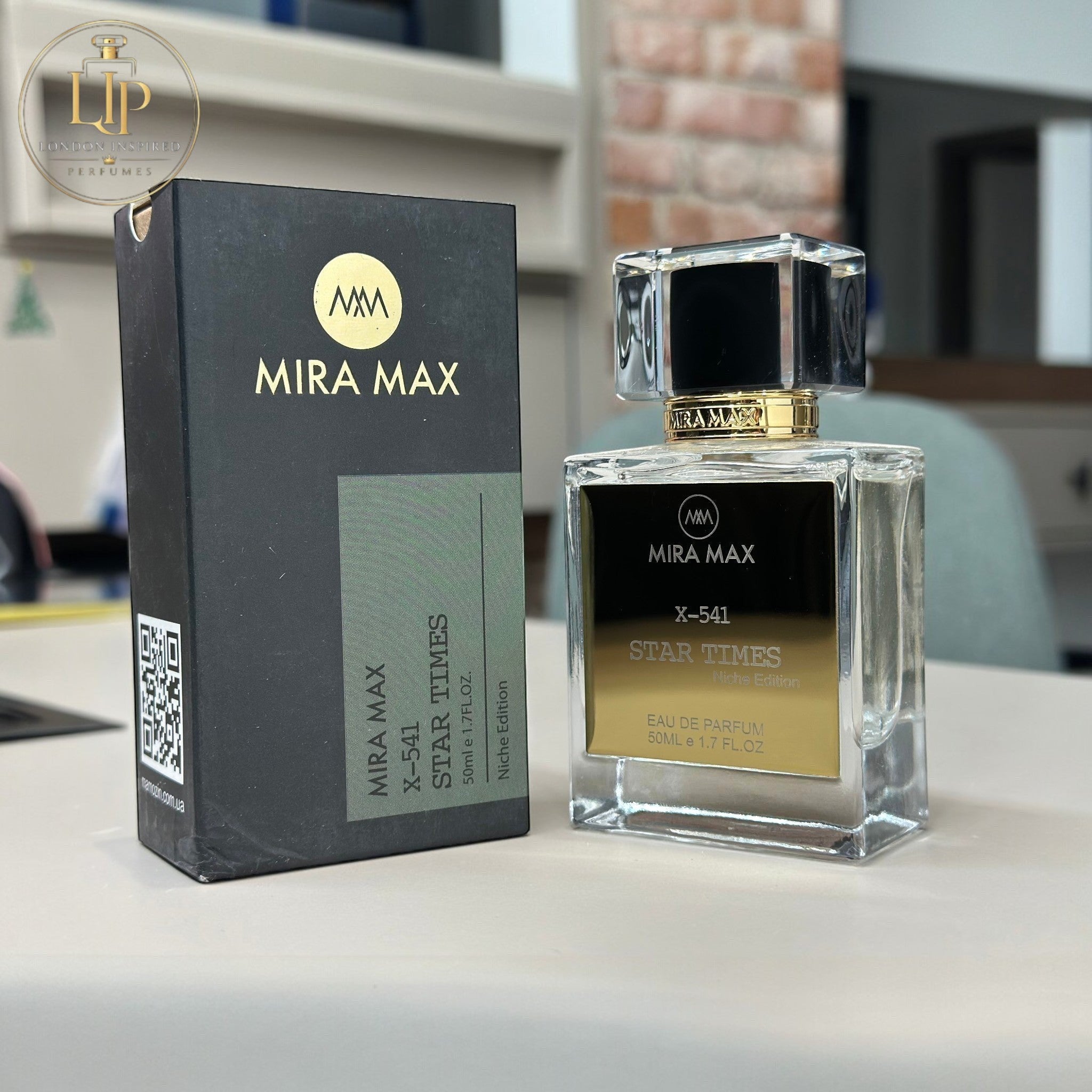 MIRA MAX perfume bottle and packaging on a table