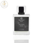 Perfume bottle labeled 'Taj Max Niche Second Skin' on a white background