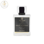 Perfume bottle labeled 'Taj Max Night in Dubai' on a white background