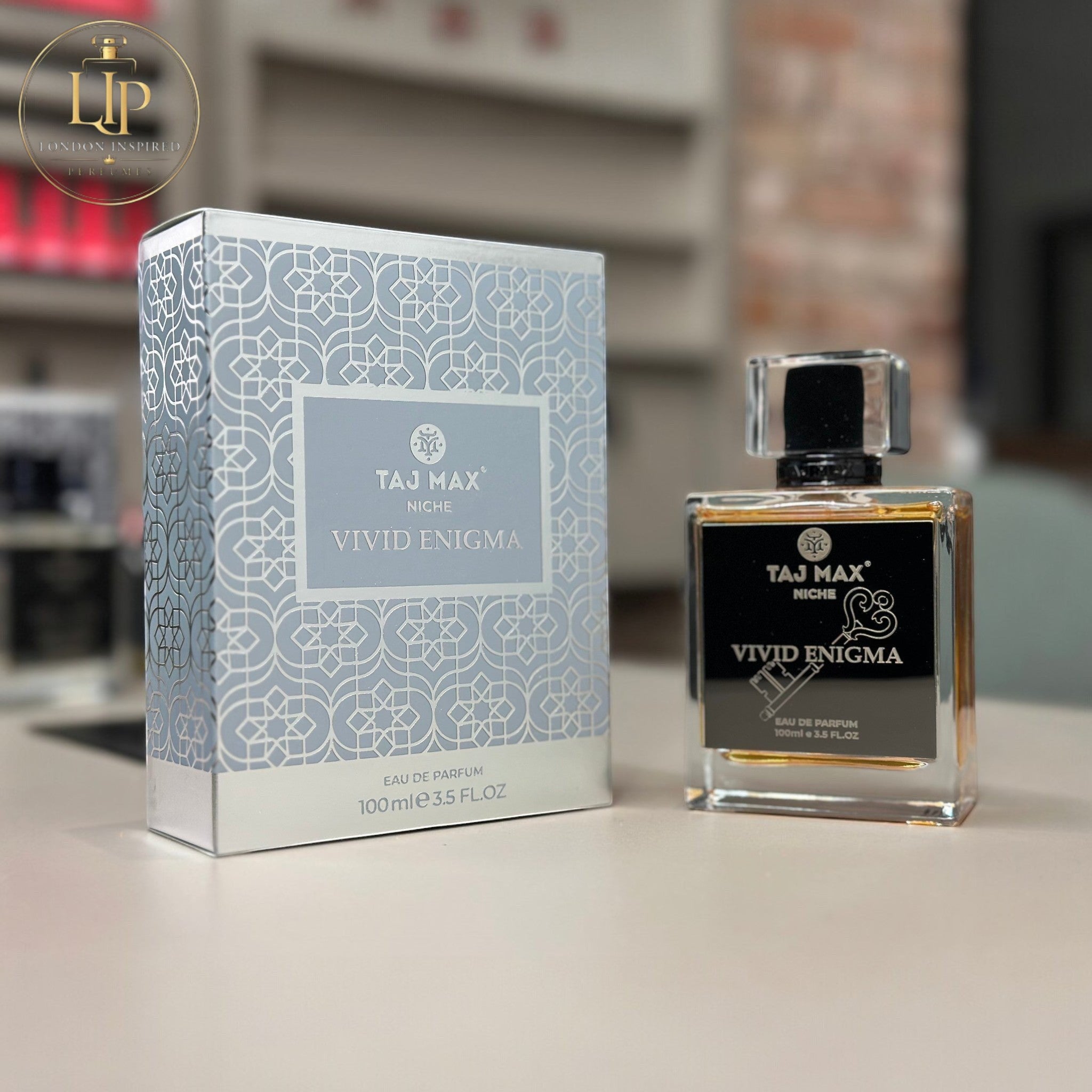 Taj Max Vivid Enigma perfume bottle and packaging on a neutral background