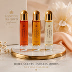 London Inspired Perfumes JM 2 For Men Eau De Parfum set of three 10ml bottles in amber, orange, and clear glass with gold caps.